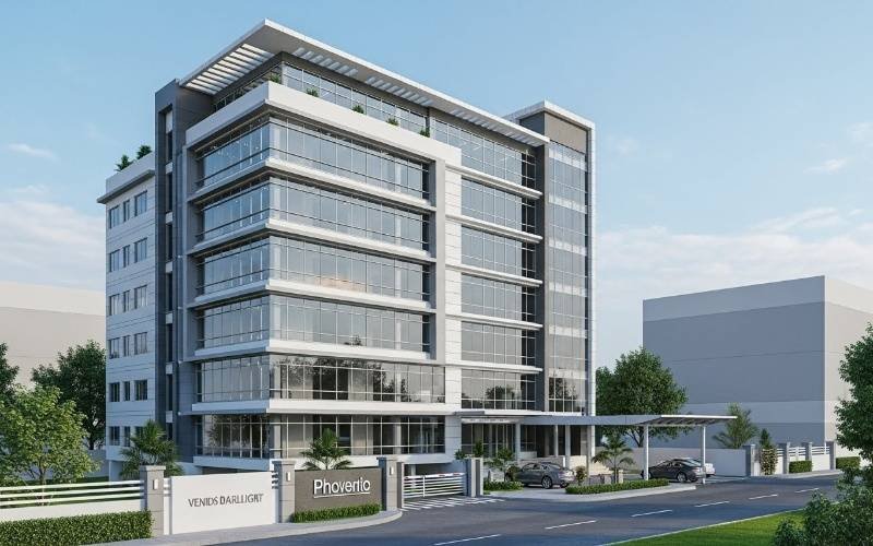 Modern multi-story office building with glass and concrete facade designed by an Experienced Commercial Building Architect in Pakistan, featuring structured floors, large windows, and professional corporate appearance.